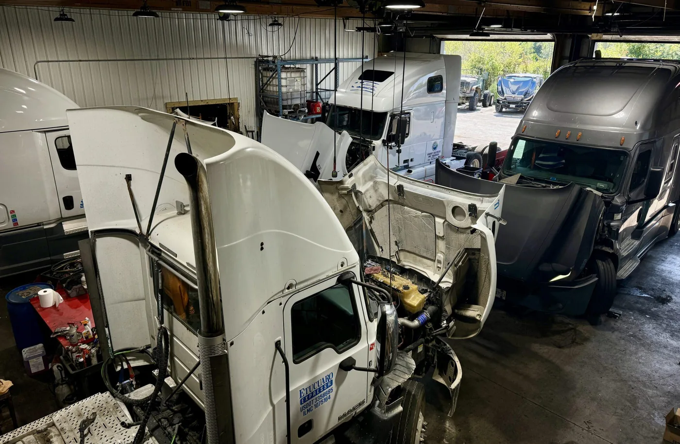Technician servicing a heavy-duty diesel truck in the Savannah Truck Repair garage